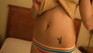 Hot  Chick Shows Her Navel Piercing And Tattoo